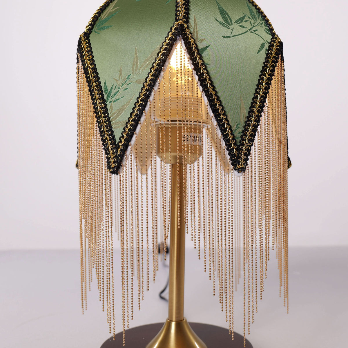 mid-century tassel table lamp styled on a small side table