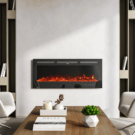 Glass-front electric fireplace with vibrant orange flames and touch screen controls, mounted on a minimalist white wall, flanked by modern shelving units, and paired with a stylish wooden coffee table featuring decor accents in a contemporary living room.