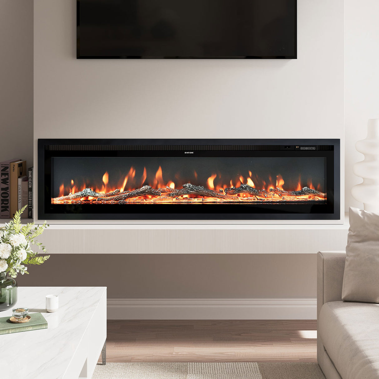 Modern recessed electric fireplace with glowing orange flames, built into a white media wall beneath a mounted TV, complemented by a sleek marble coffee table and neutral living room decor.