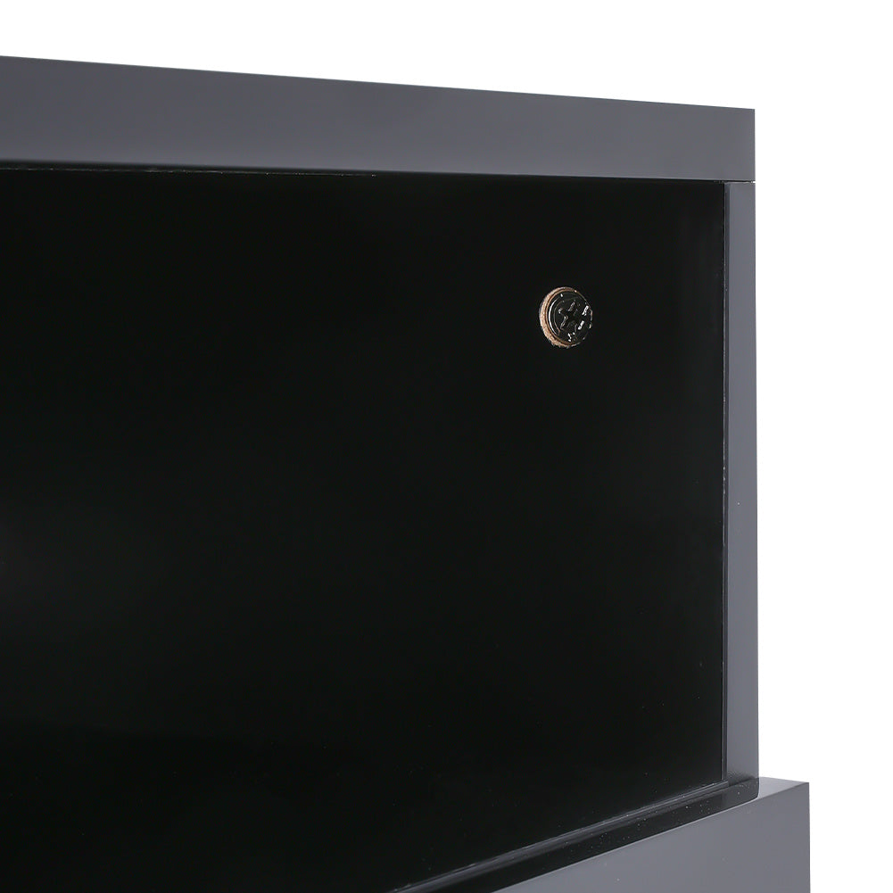 detail of black electric fireplace with storage cabinets