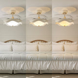 42 inch reversible ceiling fan with LED light cooling a bright bedroom