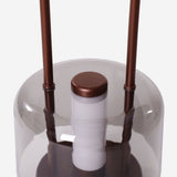 portable lantern-style ambient table lamp styled on a small side table