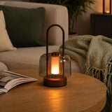 portable lantern-style ambient table lamp beside books and evening decor