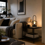 portable lantern-style ambient table lamp adding warm light to a bedroom