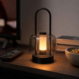 portable lantern-style ambient table lamp beside books and evening decor