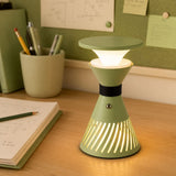 retro funnel cordless table lamp adding warm light to a bedroom