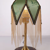 mid-century tassel table lamp styled on a small side table