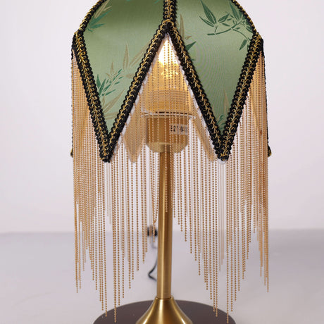 mid-century tassel table lamp styled on a small side table