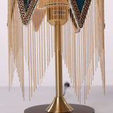mid-century tassel table lamp with close-up shade and base details